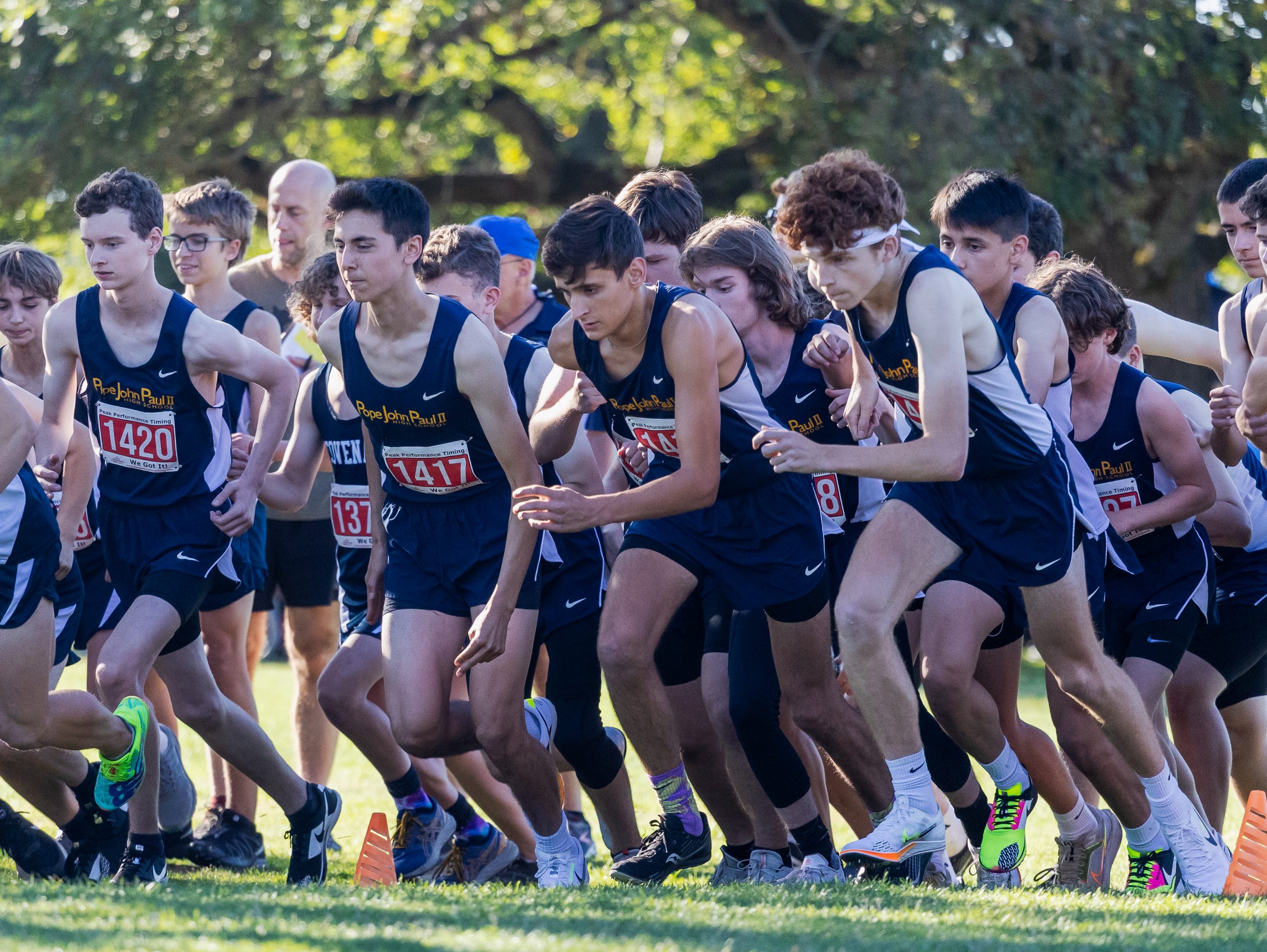 Cross country athletes at the start line.