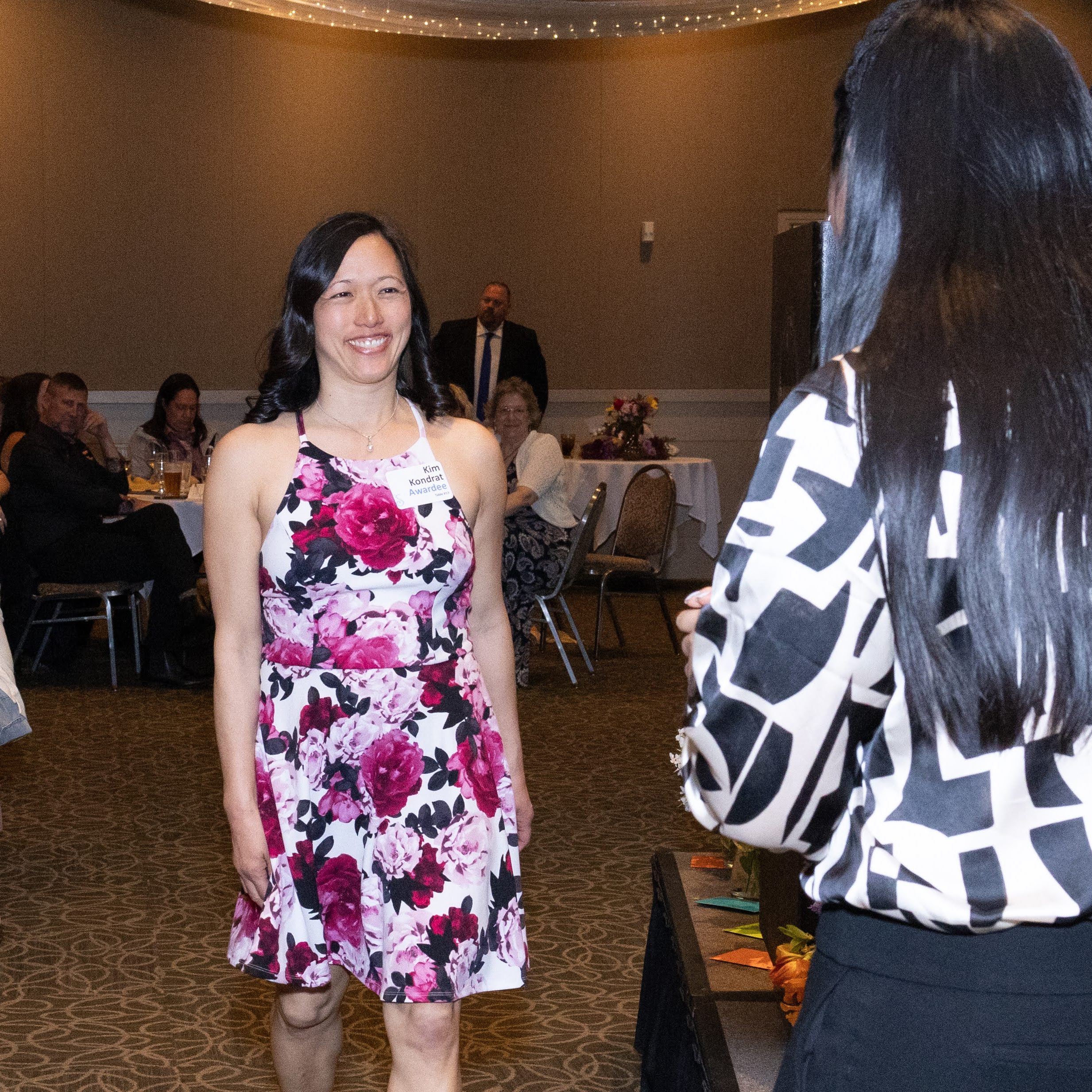 Kim Kondrat approaches the awards stage.