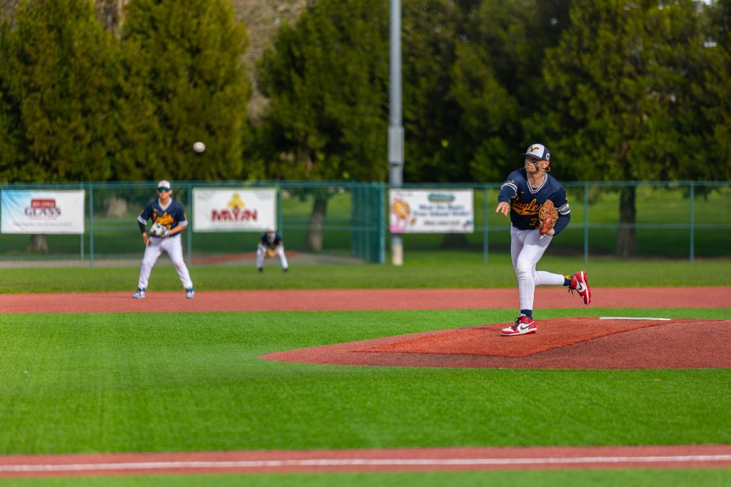 Baseball player pitching.