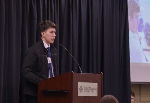 Sam shares his testimony during Take Flight in October 2025.